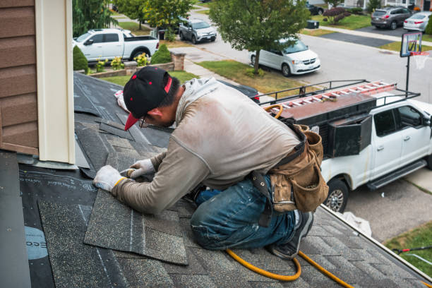 Professional Roofing technician working in Massena, IA